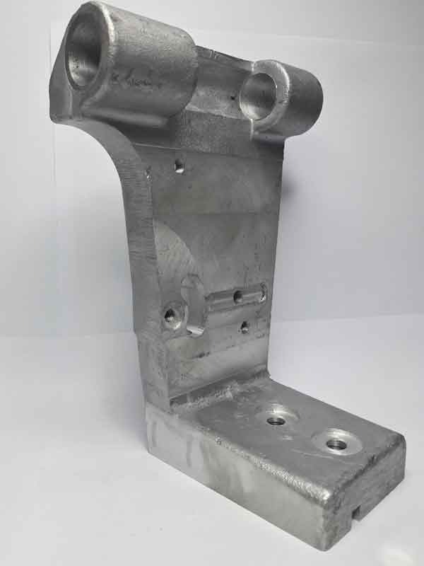 Cast aluminum bracket with machined mounting faces