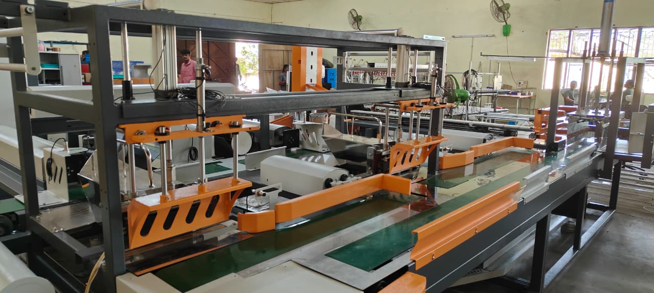Tray former assembly on the Chennai floor — custom frame and pneumatic column