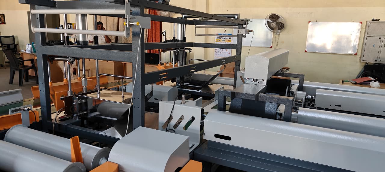 Collator and film delivery stage — integrated with adjacent unwind units